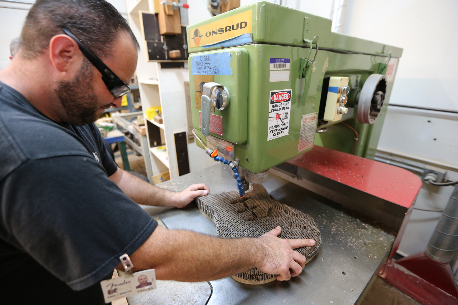 Routing the cardboard Stratocaster body on the shop machine
