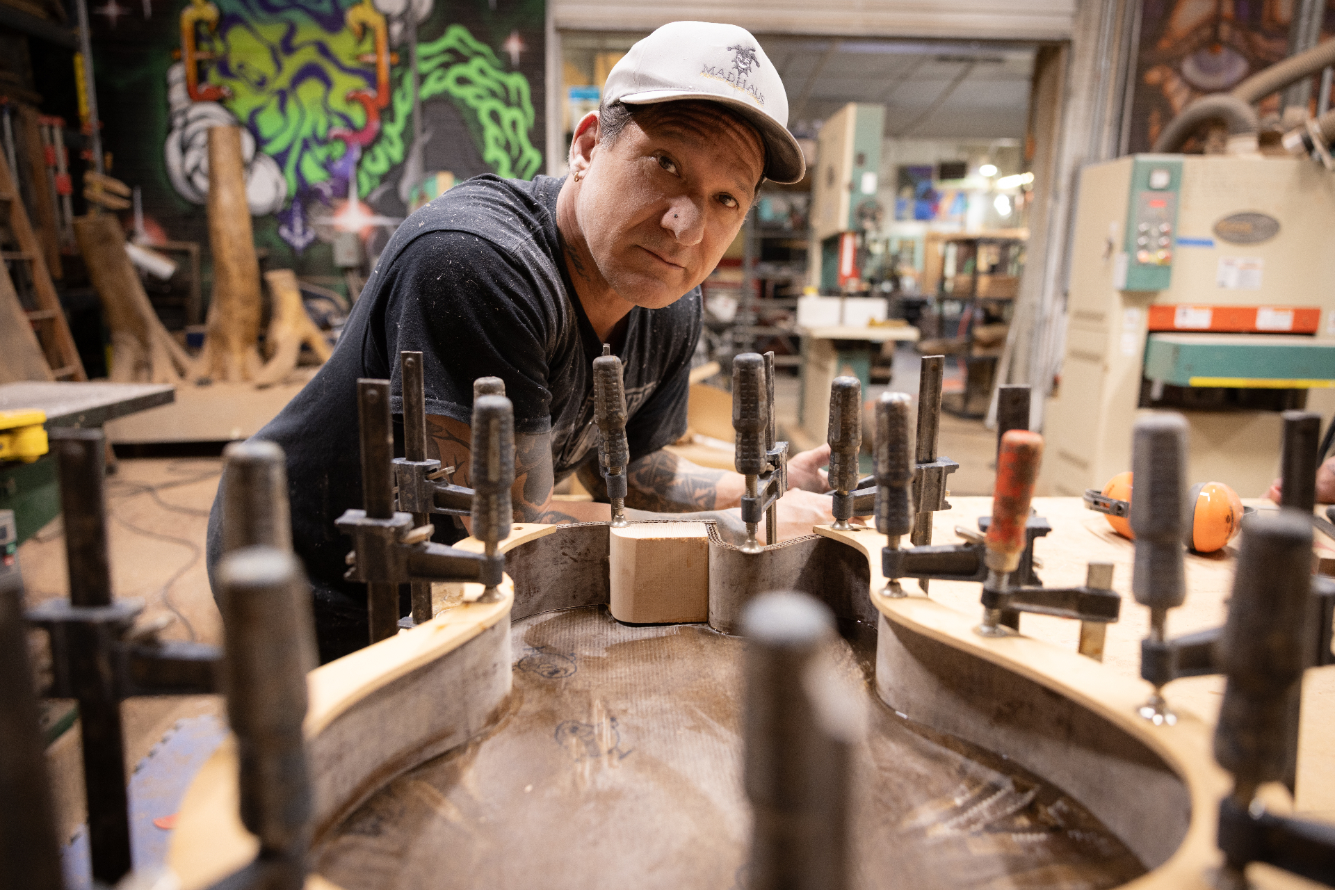 Gabriel clamping the top to the cardboard archtop body