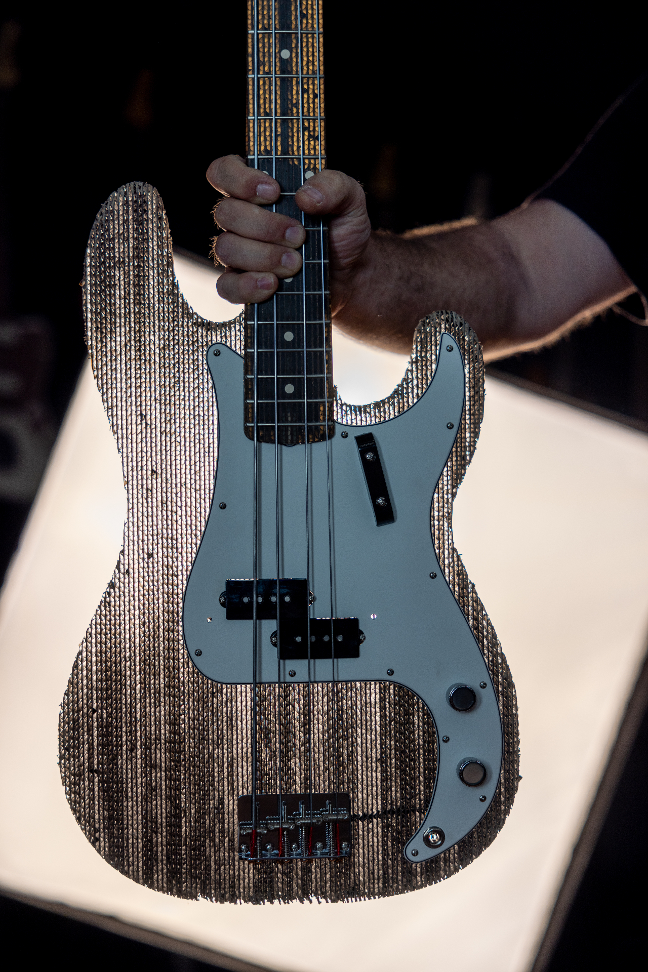 Close-up of the finished cardboard Precision Bass body and pickguard